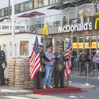 People Taking Pictures And Selfies At Check Point Charlie, Berlin, Germany